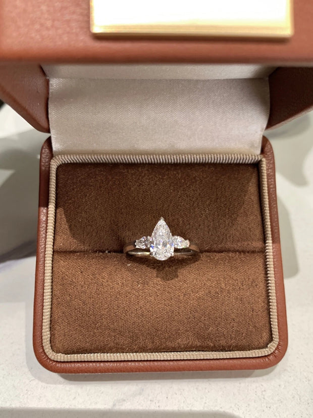 Radiate elegance with this stunning 1.01 CT lab-grown pear-shaped diamond ring.