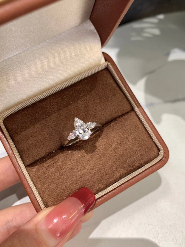 Radiate elegance with this stunning 1.01 CT lab-grown pear-shaped diamond ring.
