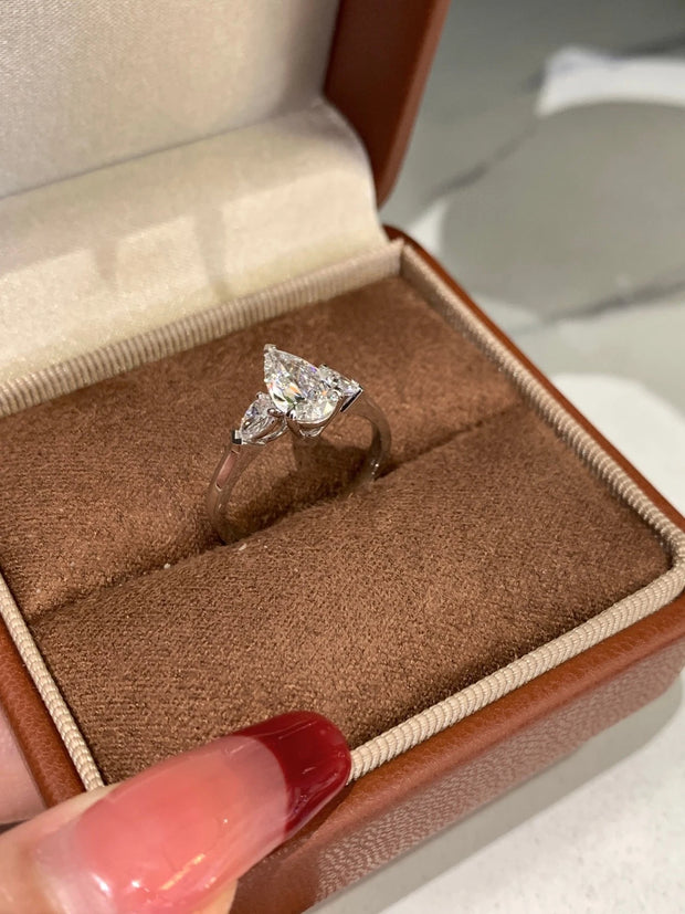 Radiate elegance with this stunning 1.01 CT lab-grown pear-shaped diamond ring.